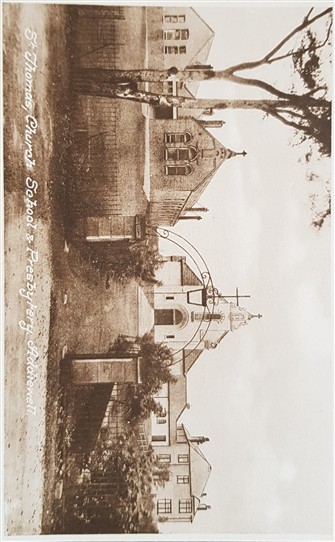 Photo:Front of church with school building on the left