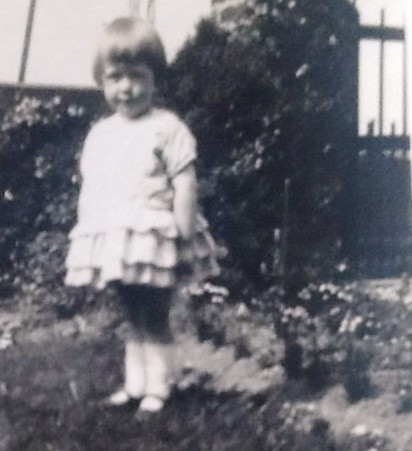 Photo:Jean Stein (Mrs Shirlaw), aged 3, in the garden of Beechwood Cottage, c.1930.