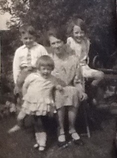 Photo:Mrs Stein with her children in the garden at Beechwood Cottage, early 1930s.