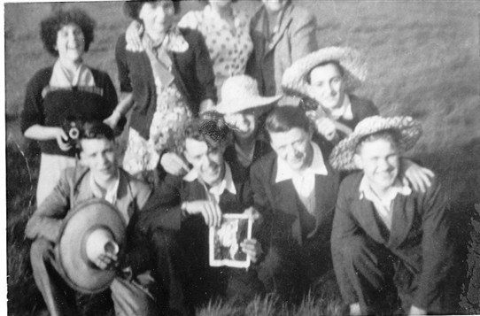 Photo:John Kelly (middle row, right), with friends on a pub trip, 1950s.