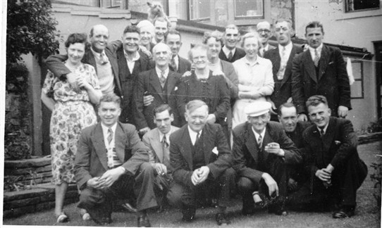 Photo:A Loganlea pub trip in the 1950s?  Back Row (L-R): Peter Corrigan ?; two unknowns;  - Dougan; Andrew - ; Johnnie Kelly; T.B.; Billy Smith.  Front (L-R): Hughie Brown; Paddy Mulligan; Willie Walker; Jock Walker; Dan McGuigan; Danny Young.