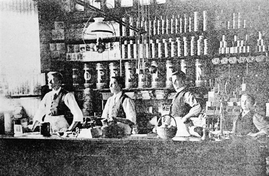 Photo:Some of the shop assistants behind the counter in the grocery department of the Co-op.